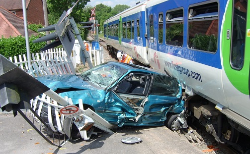 Image shows damaged car after level crossing car crash